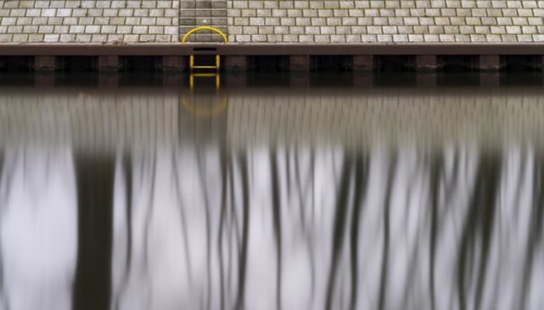 Long exposure, reflection of trees in the water of the Spree, Am Schleusenkanal, Berlin, Germany,