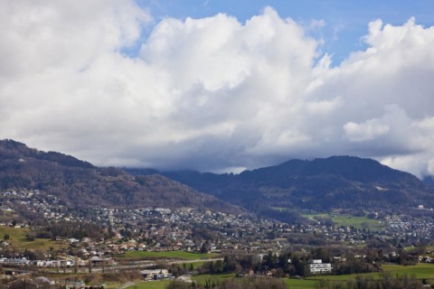 Mighty white spring clouds move over mountains near Jongny, Jongny, Riviera-Pays-d'Enhaut district,