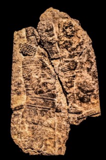 Assyrian soldier removing a statue of a god from a temple in an enemy city, Ninieveh, South-West