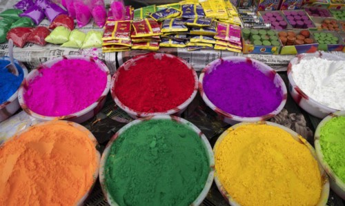 Vendor sells Holi celebration items in a street market, ahead of Holi festival on March 23, 2024 in