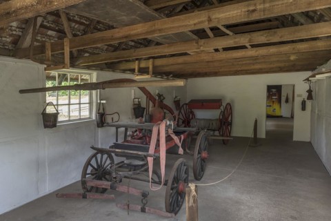 Fire engine in a fire engine house around 1900, was pulled by horses, open-air museum for folklore