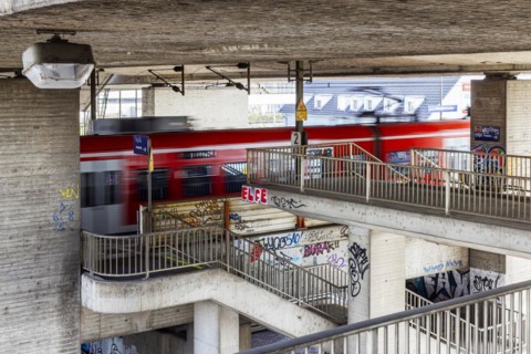 Kurt Schumacher Bridge Mannheim over the Rhine with regional train, architectural style Brutalism,