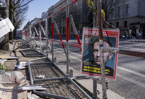 Mourners with flags and flowers in front of the Russian Embassy Unter den Linden, Berlin, Germany,