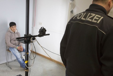 A fugitive is photographed at the Federal Police in Passau during the identification procedure,