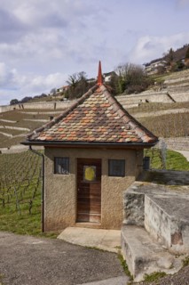 Historic small house with a square floor plan and red roof in the UNESCO World Heritage Site of the