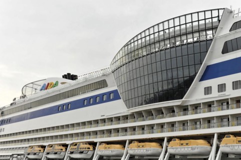 Detail, AIDALuna, The bow of a cruise ship next to modern harbour architecture, Hamburg, Hanseatic
