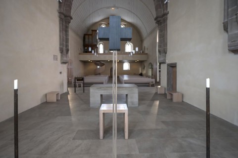 4 candles and a glass cross at the former altar site, St Clare's Church, Koenigstrasse 66,