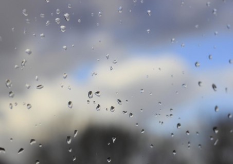 Raindrops on a window pane, North Rhine-Westphalia, Germany, Europe