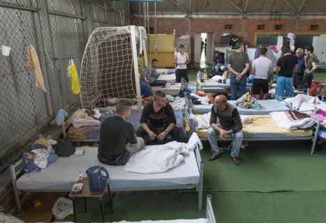 Refugees from Syria are housed in a gymnasium at the central contact point for asylum seekers in