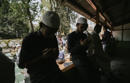 Muslim devotees offer the first Friday prayers of the holy month of Ramadan at a Mosque, on March