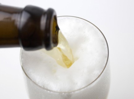 Beer is poured from a beer bottle into a beer glass, 07.12.2016