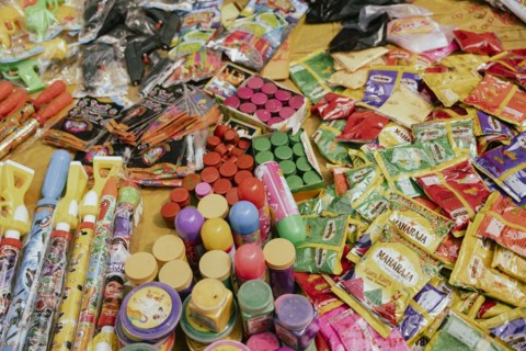 Vendor sells Holi celebration items in a street market, ahead of Holi festival on March 23, 2024 in