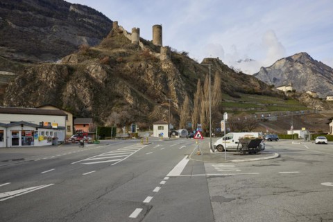 Saillon Castle with the Bayart tower and road in Saillon, district of Martigny, canton of Valais,