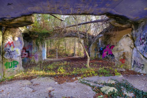 Colourfully painted ruins of a production bunker of the former explosives factory from the Third