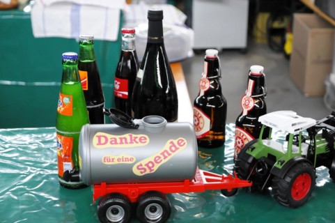 RETRO CLASSICS 2010, Stuttgart Trade Fair, Appeal for donations with a donation tin surrounded by