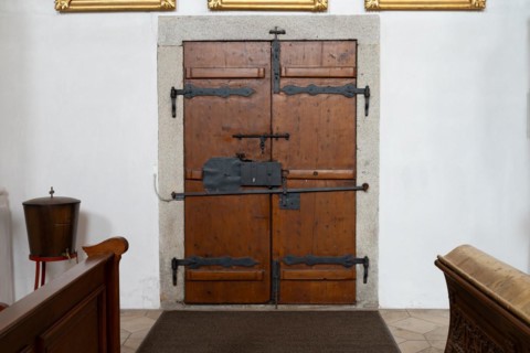 An old church door, locked with several latches, from the early 18th century, Church St. Michael,