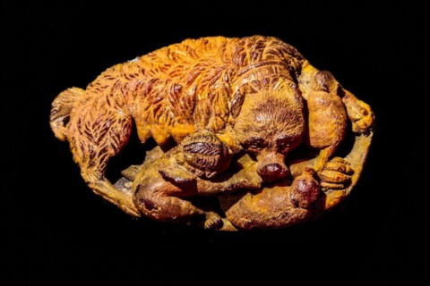 Amber-decorated objects, Cupid lying next to a dog, Archaeological Museum, Castello di Udine, seat
