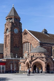 Historic Wilhelmine railway station, clock tower, pavilion with entrance to the station building,