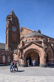 Historic Wilhelmine railway station, clock tower, pavilion with entrance to the station building,