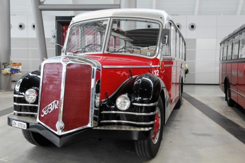RETRO CLASSICS 2010, Stuttgart Trade Fair, side view of a red and black vintage bus of the brand