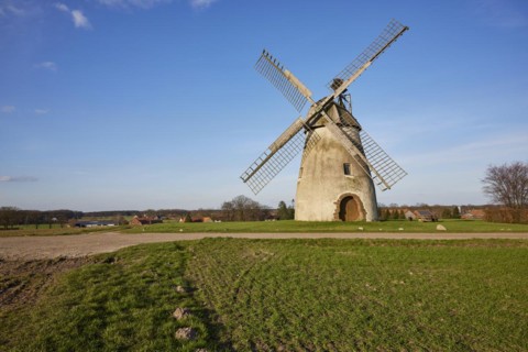 Windmill Auf der Hoechte under an almost cloudless blue sky is part of the Westphalian Mill Road in