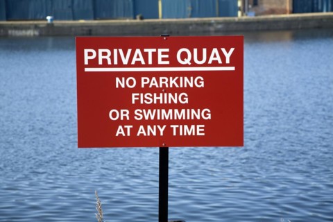 Private Quay sign no swimming fishing parking at any time, Wet Dock, Ipswich, England, UK