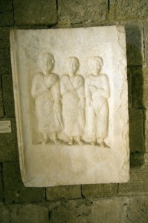 Grave stele two males and a female figures from Nisyros Archaeological museum, Rhodes, Greece,