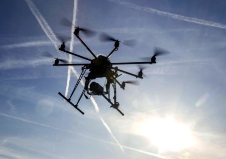 An octocopter drone filming with a video camera, 10.12.2015