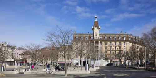 Magnificent facade and clock tower on Place de la Navigation in the Ouchy neighbourhood, Lausanne,
