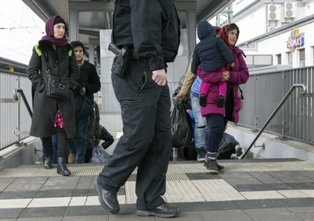 Refugees arriving at Rosenheim station, being taken to registration by federal police officers,