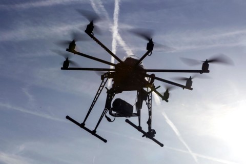An octocopter drone filming with a video camera, 10.12.2015
