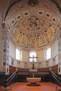Interior view of the west choir with ceiling fresco, baptismal font and crucifix from UNESCO St