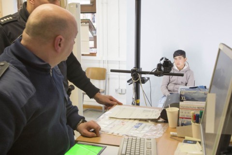 A fugitive is photographed at the Federal Police in Passau during the identification procedure,