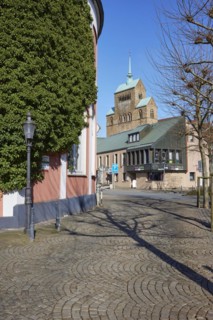 City centre with cobblestones, lanterns and commercial buildings and Minden Cathedral, Muehlenkreis