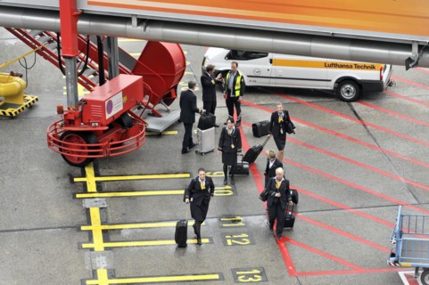 Aircraft crew leaving the aircraft via a gangway on the tarmac, Hamburg, Hanseatic City of Hamburg,