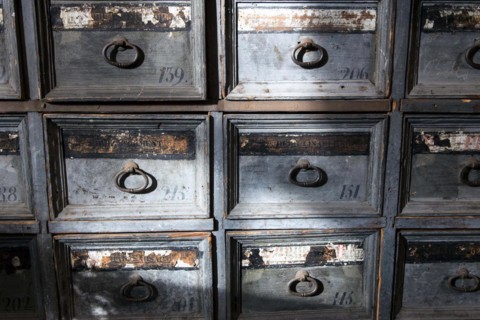 Shelves with drawers containing ingredients for the production of medicines can be found in the