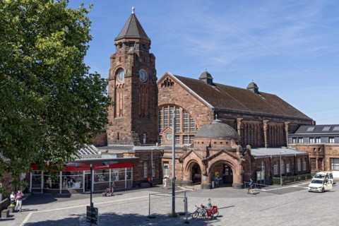 Historic Wilhelmine railway station, clock tower, pavilion with entrance to the station building,