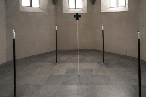4 candles and a glass cross at the former altar site, St Clare's Church, Koenigstrasse 66,