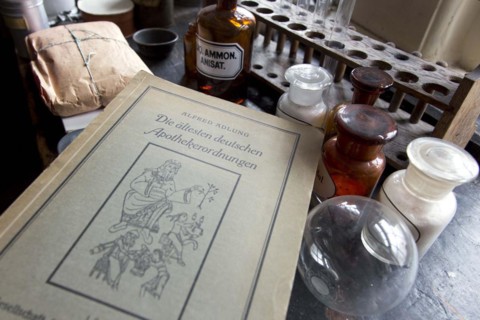 An old book on German pharmacy regulations lies on a worktable in the former laboratory of the