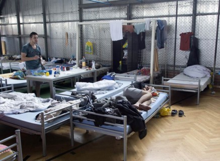 Refugees from Syria are housed in a gymnasium at the central contact point for asylum seekers in