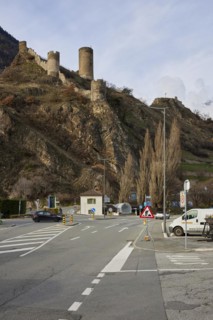 Saillon Castle with the Bayart tower and road in Saillon, district of Martigny, canton of Valais,