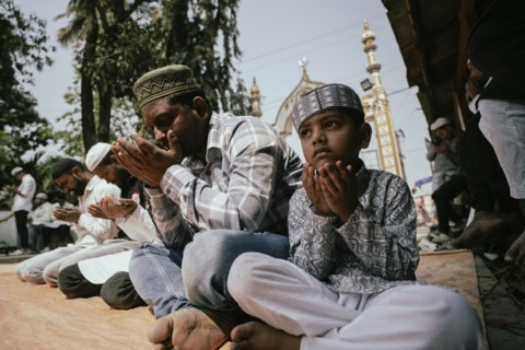 Muslim devotees offer the first Friday prayers of the holy month of Ramadan at a Mosque, on March