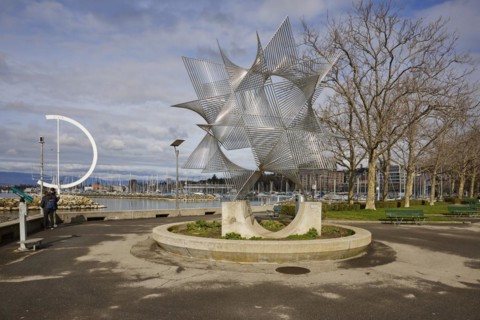 Art object Ouverture au Monde by artist Angel Duarte and the large, semi-circular wind vane Eole, a