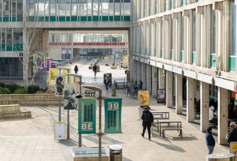 Students walking in campus square area, University of Essex, Colchester, Essex, England, UK