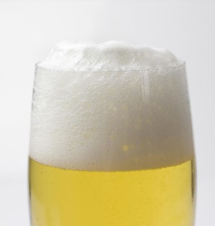 Freshly tapped beer with a head of foam in the beer glass, 07.12.2016