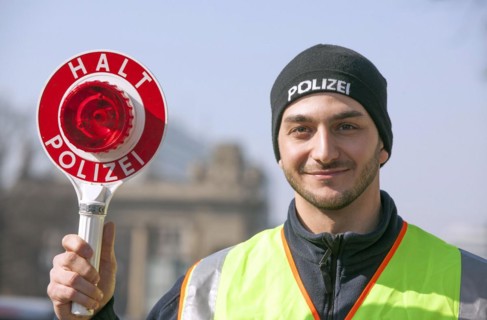 Berlin police officer with a police trowel during a traffic stop, 20/03/2015