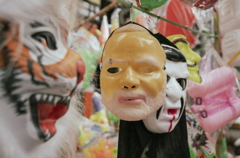Vendor sells Holi celebration items in a street market, ahead of Holi festival on March 23, 2024 in