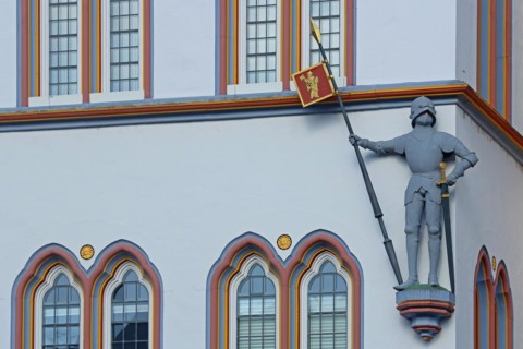 Knight with armour, lance, helmet and sword at the historic house Steipe built in 1430, figure,