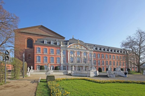 Electoral Palace and Constantine Basilica with palace garden in spring and daffodils, Trier,