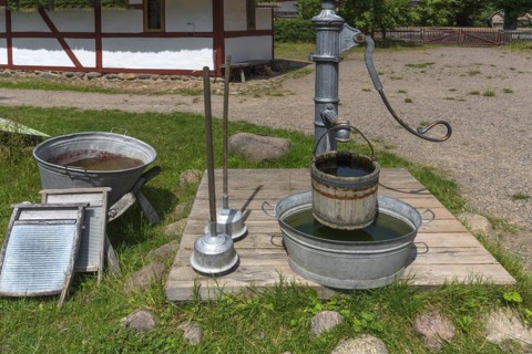 Laundry area with water pump in the garden from the 19th century, Open-Air Museum of Folklore